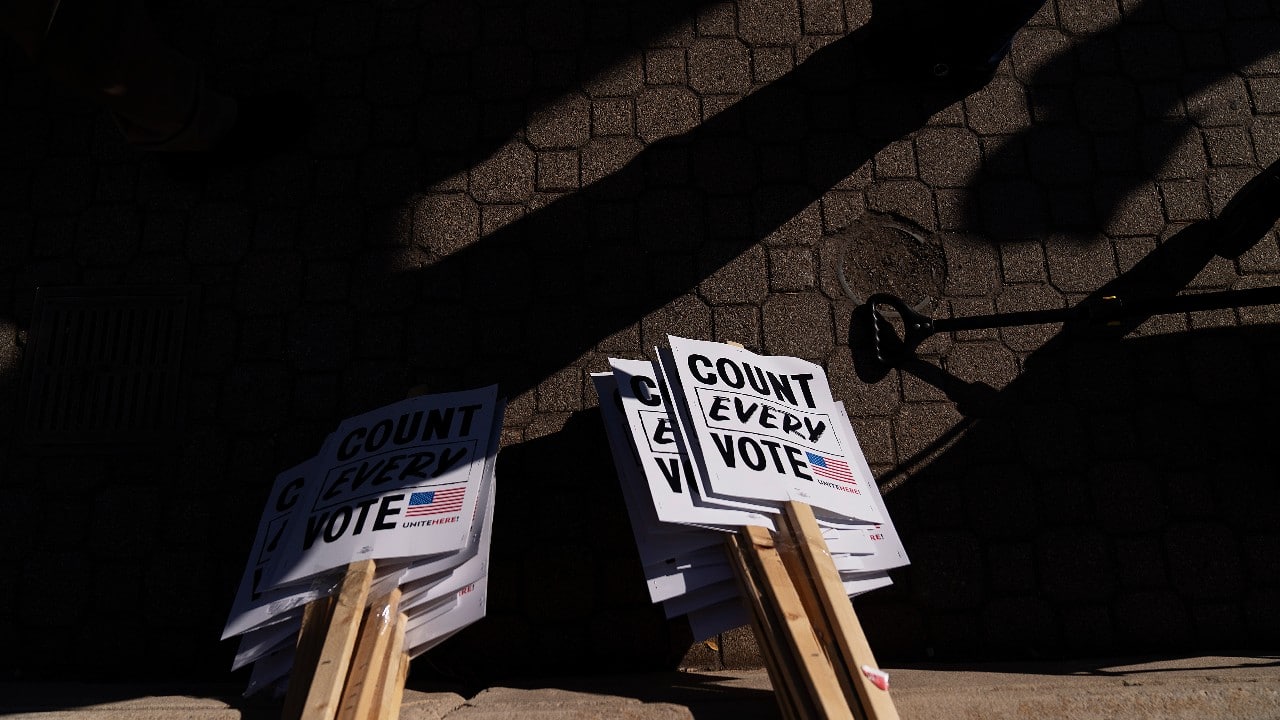 In Michigan and Arizona, dozens of supporters of President Donald Trump converged on vote-counting centres as the results went against him in the two key states. Signs sit on the ground before a rally calling for every vote to be counted from November 3's general elections near the Detroit Department of Elections building in Detroit, Michigan. (Image: AP/David Goldman)