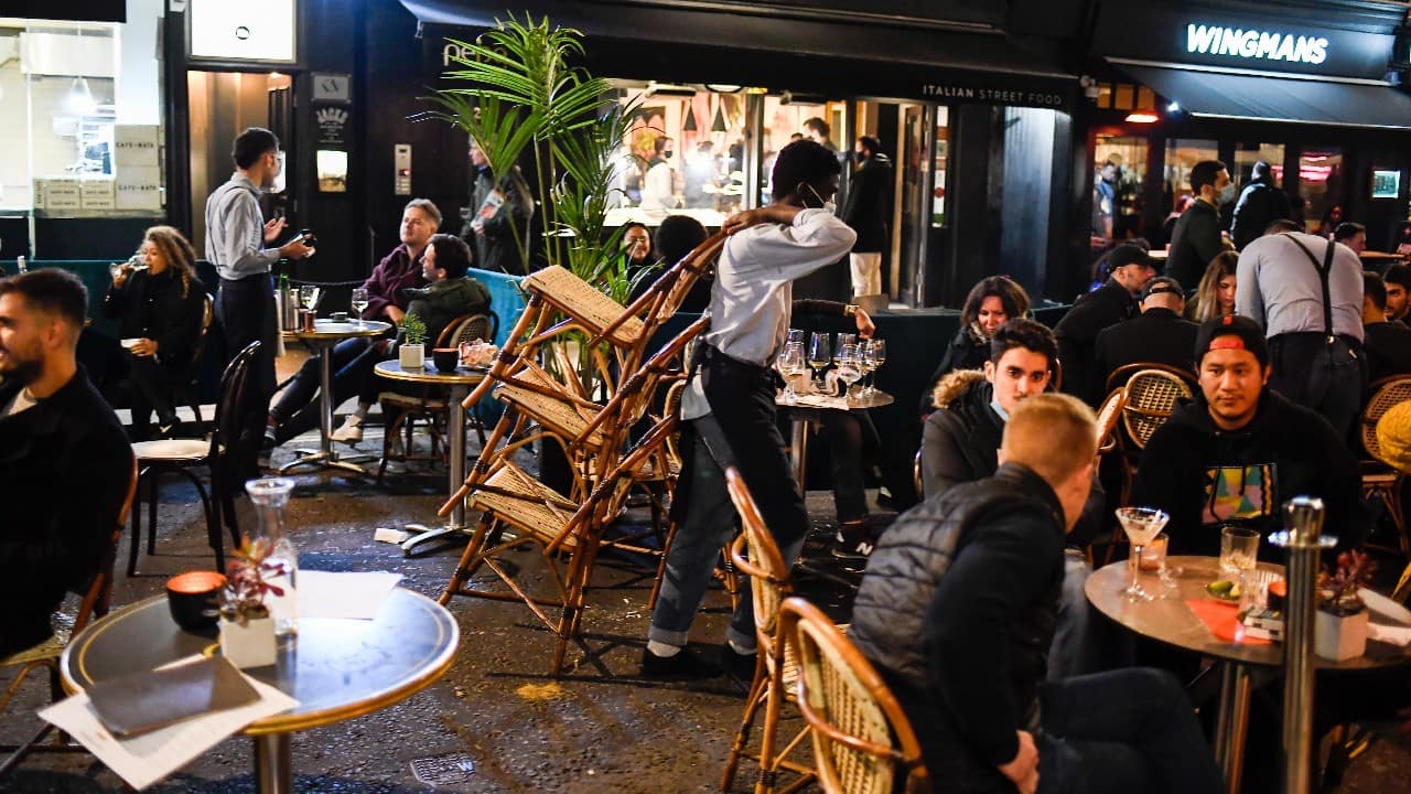 That order came after a sudden change of course last weekend by Britain's government, which had for weeks been advocating a targeted regional response to the pandemic instead of another national lockdown. A waiter packs away chairs in London's Soho area just before the start of a national lockdown for England, November 4. (Image: AP)