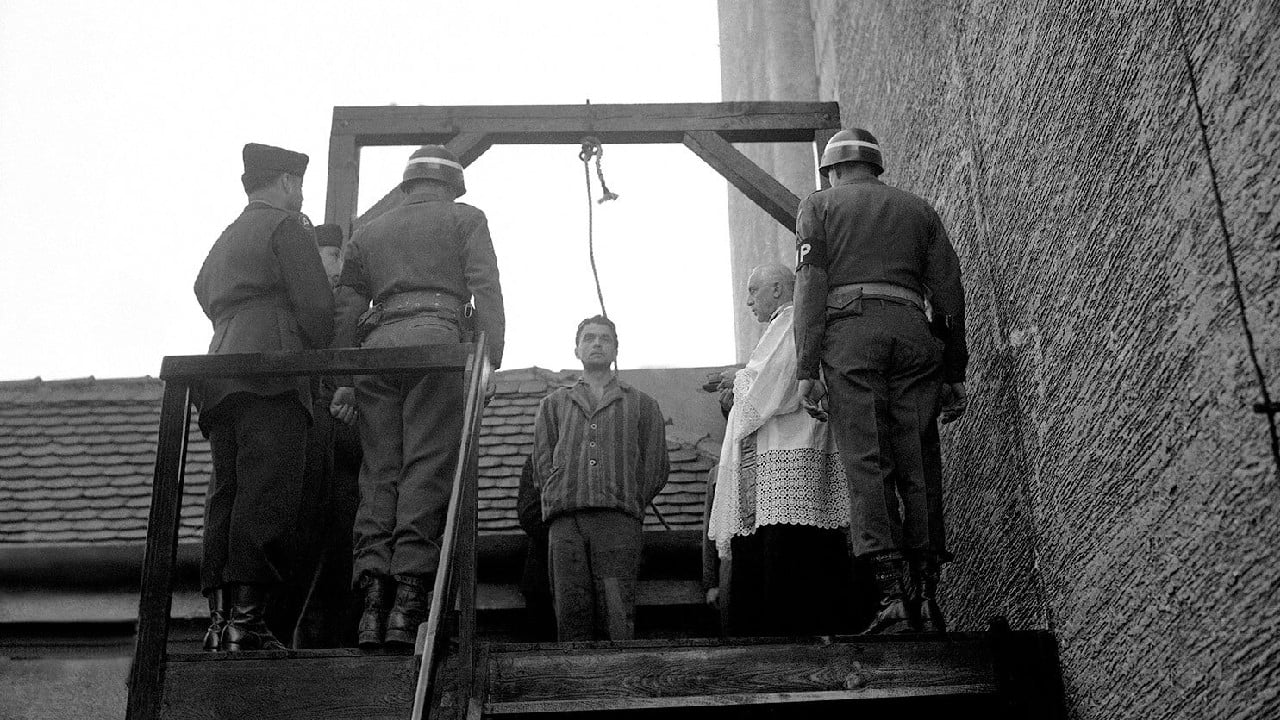 Simon Kiern, 32, former Nazi censor and block leader convicted at Dachau of kicking to death prisoner who had fallen to ground, is prepared to be hung by US military authorities at Landsberg, Germany on May 28, 1946. (Image: AP) Simon Kiern, 32, former Nazi censor and block leader convicted at Dachau of kicking to death prisoner who had fallen to ground, is prepared to be hung by US military authorities at Landsberg, Germany on May 28, 1946. (Image: AP)