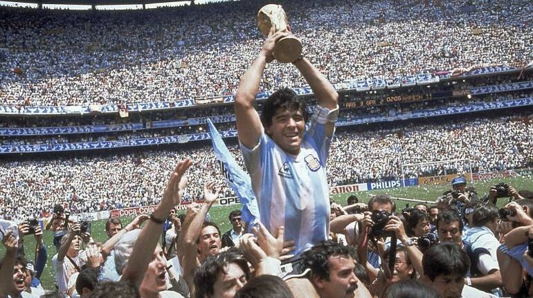 File image: Diego Maradona holds up his team's trophy after Argentina's 3-2 victory over West Germany at the 1986 World Cup final (AP Photo/Carlo Fumagalli, File)