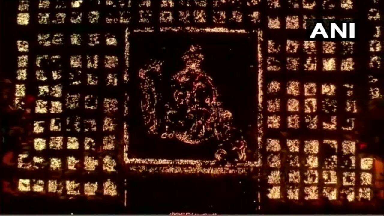 As dusk fell, volunteers lit up nearly six lakh diyas' lined up on the Saryu riverbank. &quot;Representatives of the Guinness Book of World Records witnessed this grand festival. With 5,84,372 earthen lamps, the event made the world record,&quot; a state government statement said. (Image: ANI)