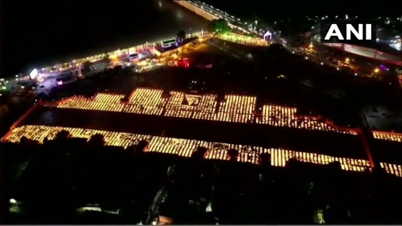 The Deepotsav included the reenactment of the arrival of God Ram and Goddess Sita to Ayodhya on their 'pushpak viman', a laser and sound show, cultural programmes and the lighting of a record 5.51 lakh earthen lamps on the banks of the Saryu. (Image: ANI)