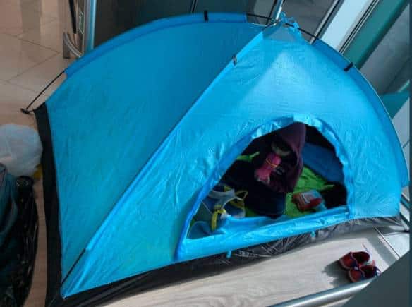 Passenger Neelima Mahajan and her family waited out in a tent at Hong Kong airport for their test results