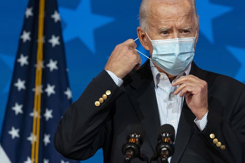 Democratic presidential candidate former Vice President Joe Biden removes his face mask to speak at The Queen theater, Thursday, Nov. 5, 2020, in Wilmington, Del. (Image: AP Photo)