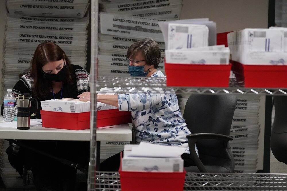 Lehigh County workers count ballots as vote counting in the general election continues, Thursday, Nov. 5, 2020, in Allentown, Pa. (Image: AP Photo)