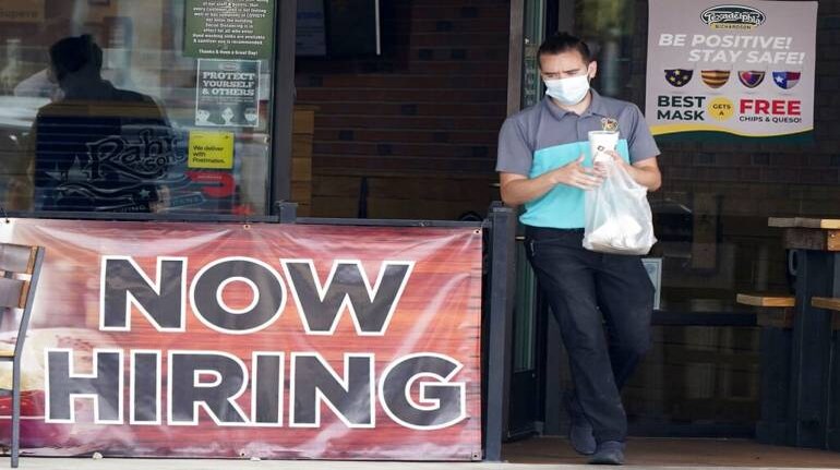 US applications for jobless benefits fall again as labor market