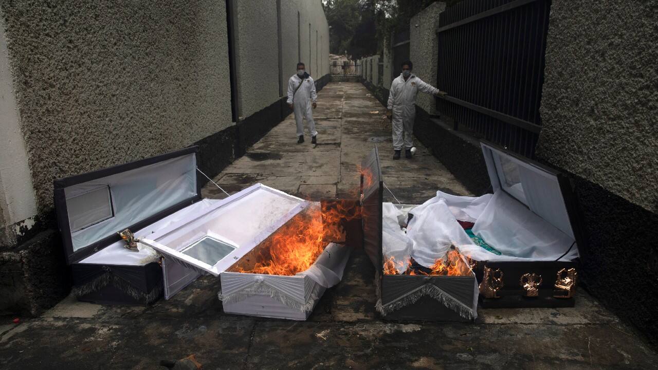 The coffins of COVID-19 victims burn after their bodies were cremated at the San Nicolas Tolentino cemetery in the Iztapalapa neighborhood of Mexico City, June 24. (Image: AP)