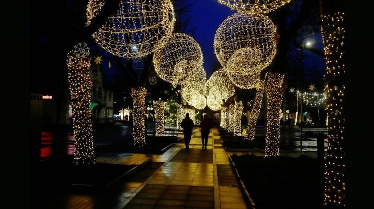 People walk under the Christmas street illuminations in Ogre, Latvia December 22. (Image: Reuters). Representational image. 