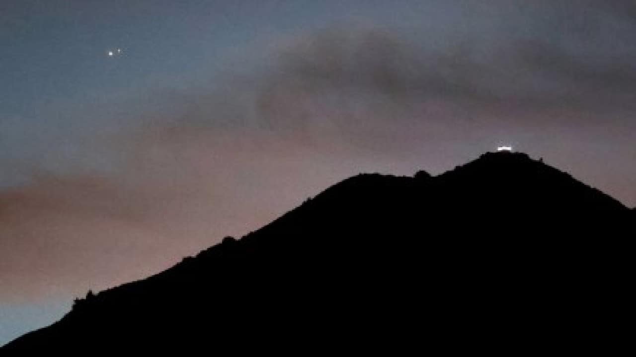 Optimal "conjunction" took place at 11:52 IST on December 21. The best viewing conditions on Monday were in clear skies and close to the Equator, while people in Western Europe and along a vast swathe of Africa had to train their sight to the southwest. (Image: AFP)