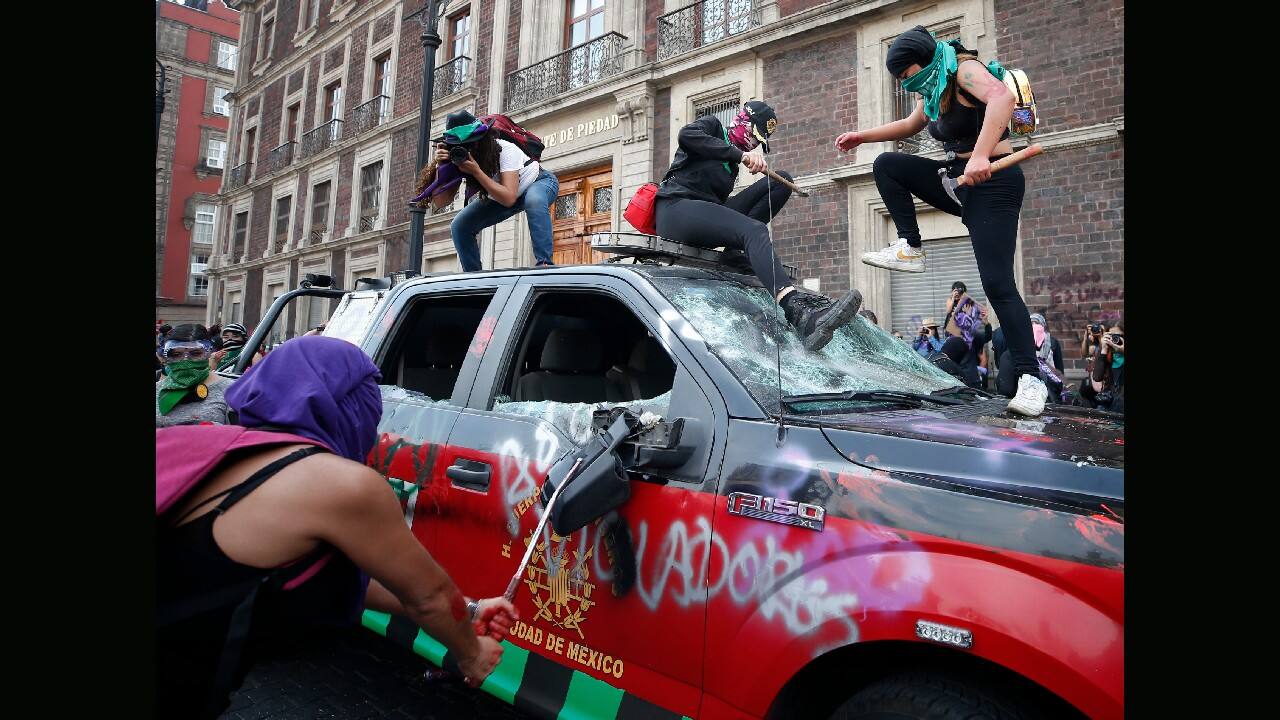 Demonstrators attack a fire department truck to protest gender violence during a march marking International Women's Day in Mexico City's main square, the Zocalo, March 8. (Image: AP)