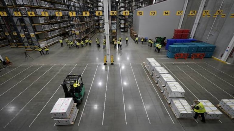 Boxes containing the Pfizer-BioNTech COVID-19 vaccine are prepared to be shipped at the Pfizer Global Supply Kalamazoo manufacturing plant in Portage, Mich., Sunday, Dec. 13, 2020. (AP Photo/Morry Gash, Pool)