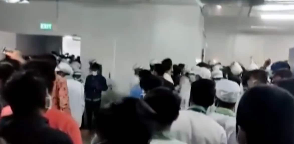 Workers assemble amidst violence at Wistron plant