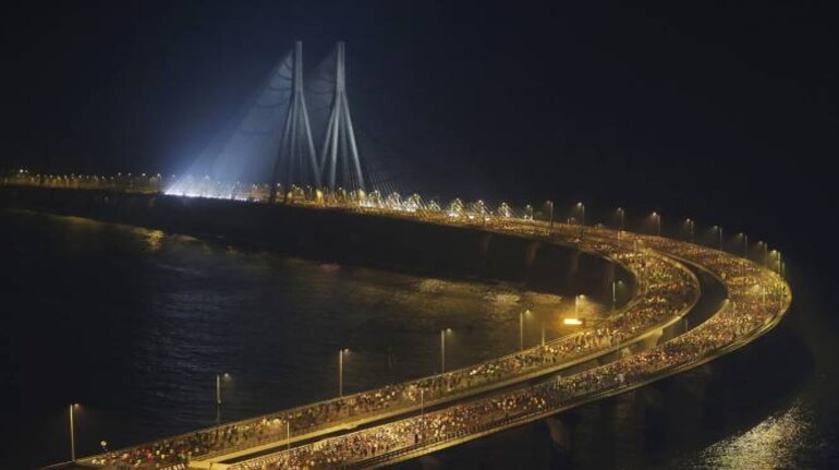 Runners compete along the Bandra-Worli sea link over the Arabian Sea during the Mumbai Marathon in Mumbai, India, Sunday, Jan. 19, 2020. Thousands of the city's residents alongside athletes took part in the marathon. (Image: AP)