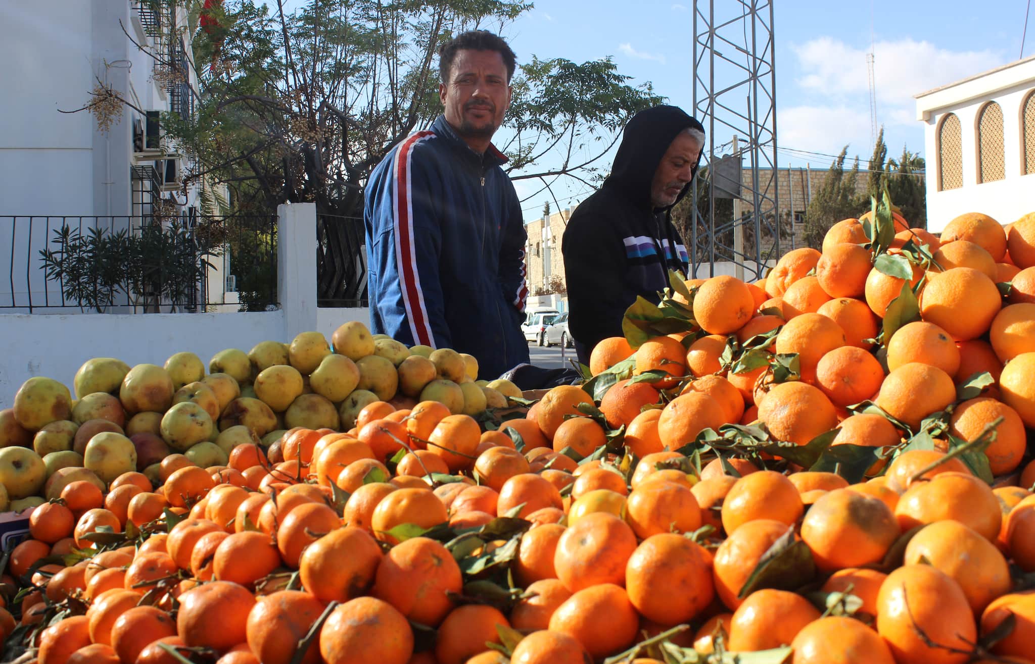 Mohammed Bouali, 37, a street fruit seller who used to work on the same street with Mohamed Bouazizi, stands near his cart in Sidi Bouzid, Tunisia December 8, 2020. Picture taken December 8, 2020. REUTERS/Angus McDowall - RC2MNK9ZWP3W