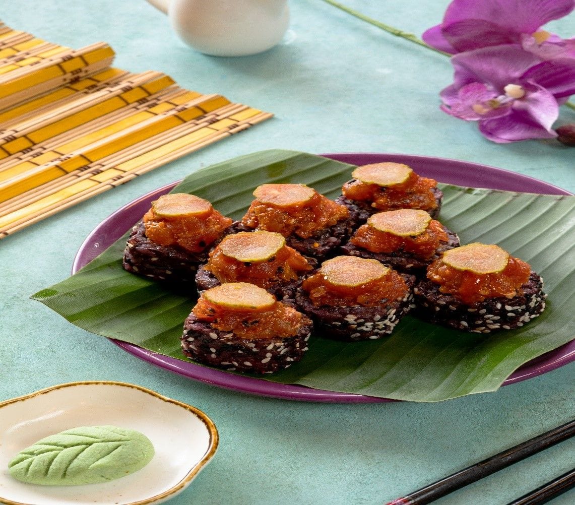 Tuna over loaded sushi roll.