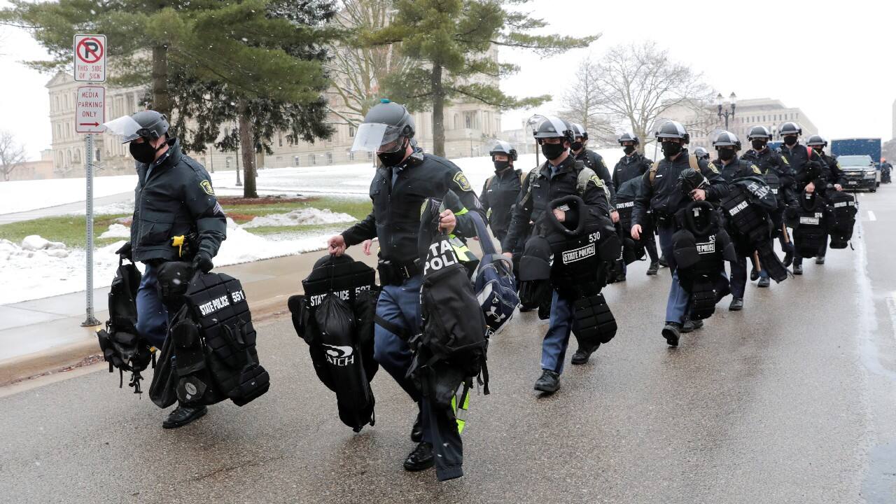 Members of the State police arrive at the Michigan state Capitol in Lansing, Michigan, U.S. January 17. (Image: Reuters) Members of the State police arrive at the Michigan state Capitol in Lansing, Michigan, U.S. January 17. (Image: Reuters)