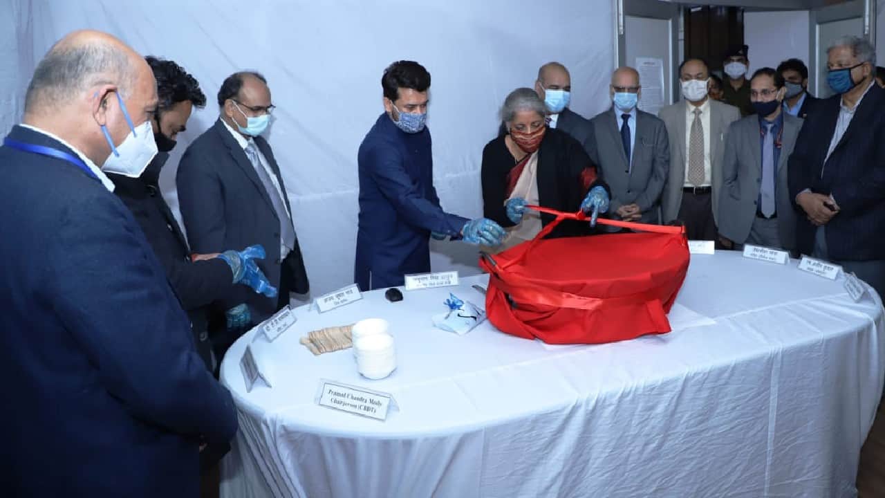 Marking the final stage of the Budget making process for Union Budget 2021-2022, Halwa ceremony was held at Finance Ministry on January 23 in the presence of Finance Minister Nirmala Sitharaman. A customary Halwa ceremony is performed every year before the “lock-in” process of Budget preparation begins. (Image: Twitter @FinMinIndia)