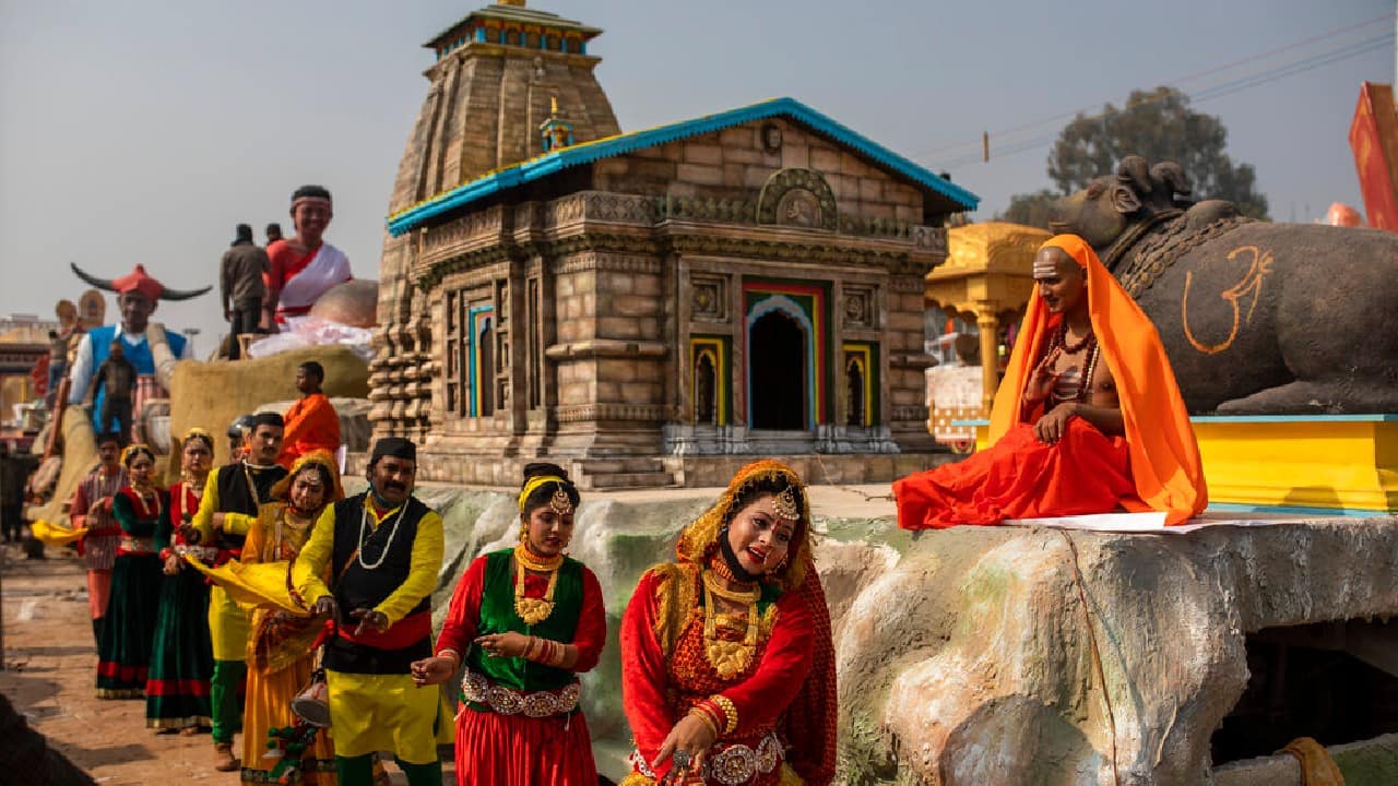 Folk artists from Uttarakhand state dance next to their Tableaux during a press preview of the upcoming Republic Day parade, in New Delhi, January 22. (Image: AP)