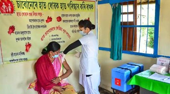 A medic demonstrates administration of COVAXIN, an Indian government-backed experimental COVID-19 vaccine, to a health worker during its trials, at the Urban Primary Health Centre at Tezpur in Assam. (Image: PTI)