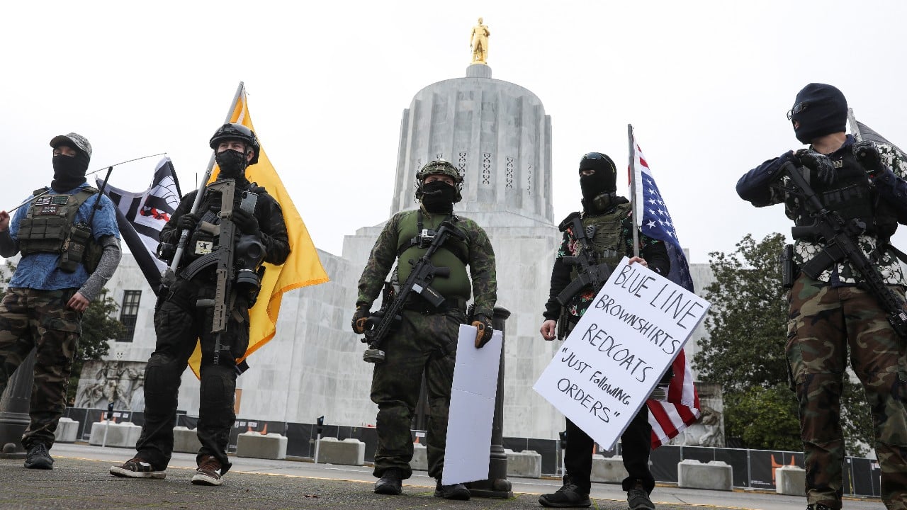 An armed group, who identify as "Liberty Boys" and the anti-government group "Boogaloo Bois" protest outside the Oregon State Capitol, as they advocate for less government control, in Salem, Oregon, U.S., January 17. (Image: Reuters) An armed group, who identify as "Liberty Boys" and the anti-government group "Boogaloo Bois" protest outside the Oregon State Capitol, as they advocate for less government control, in Salem, Oregon, U.S., January 17. (Image: Reuters)