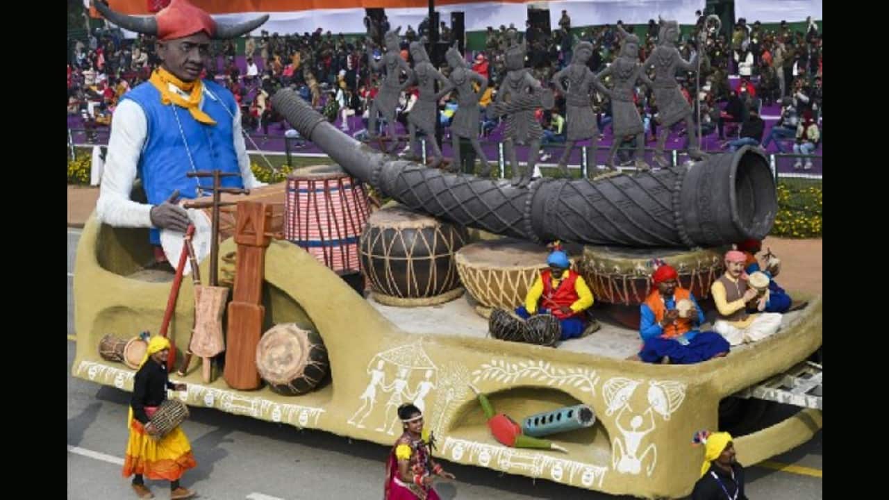 Performers dance next to a float during the full dress rehearsal for the upcoming Republic Day Parade in New Delhi on January 23. (Image: AFP)