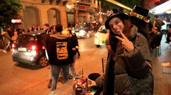 A Lebanese woman celebrates the New Year in Beirut, Lebanon. (Image: AP Photo/Hussein Malla)