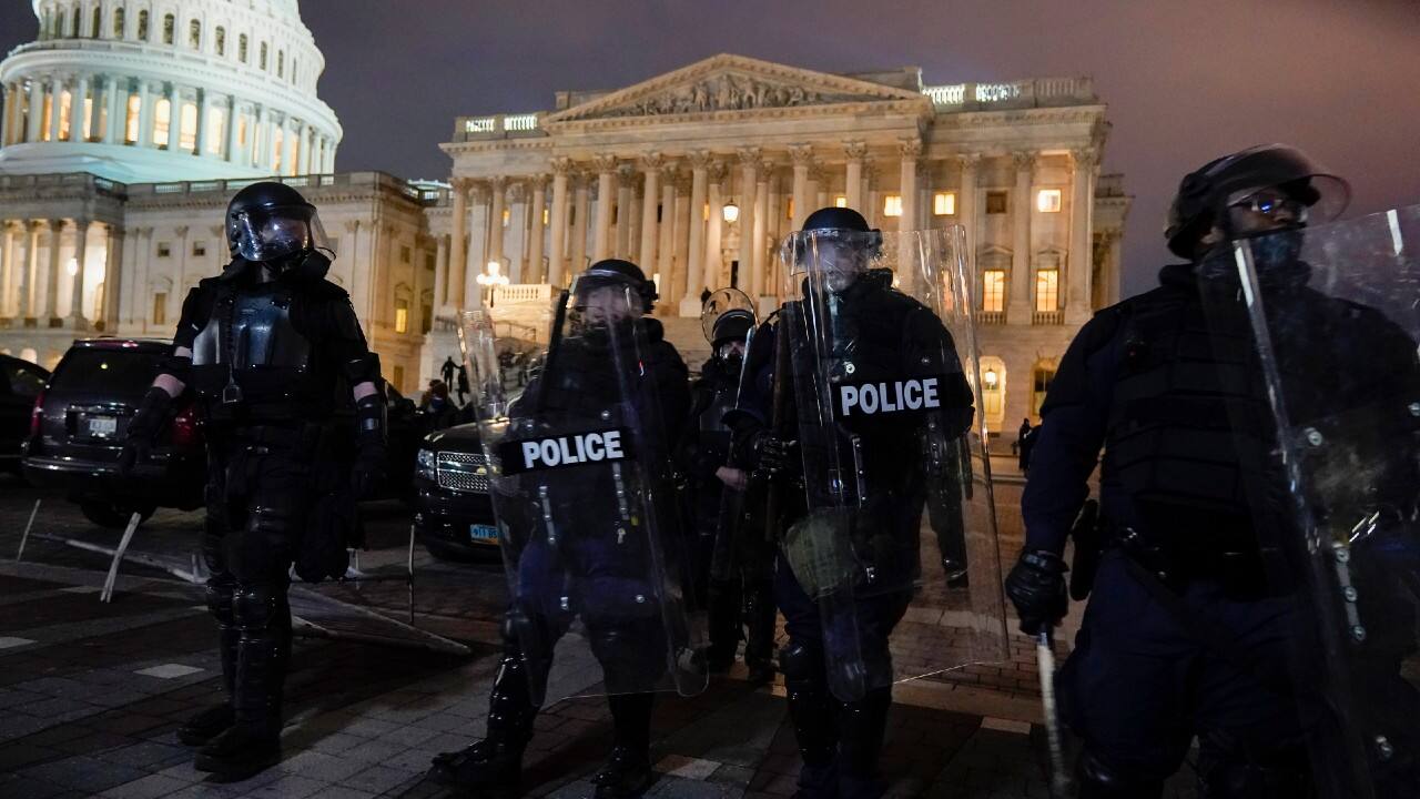 Authorities remove protesters from the US Capitol. (Image: AP Photo/Jacquelyn Martin)