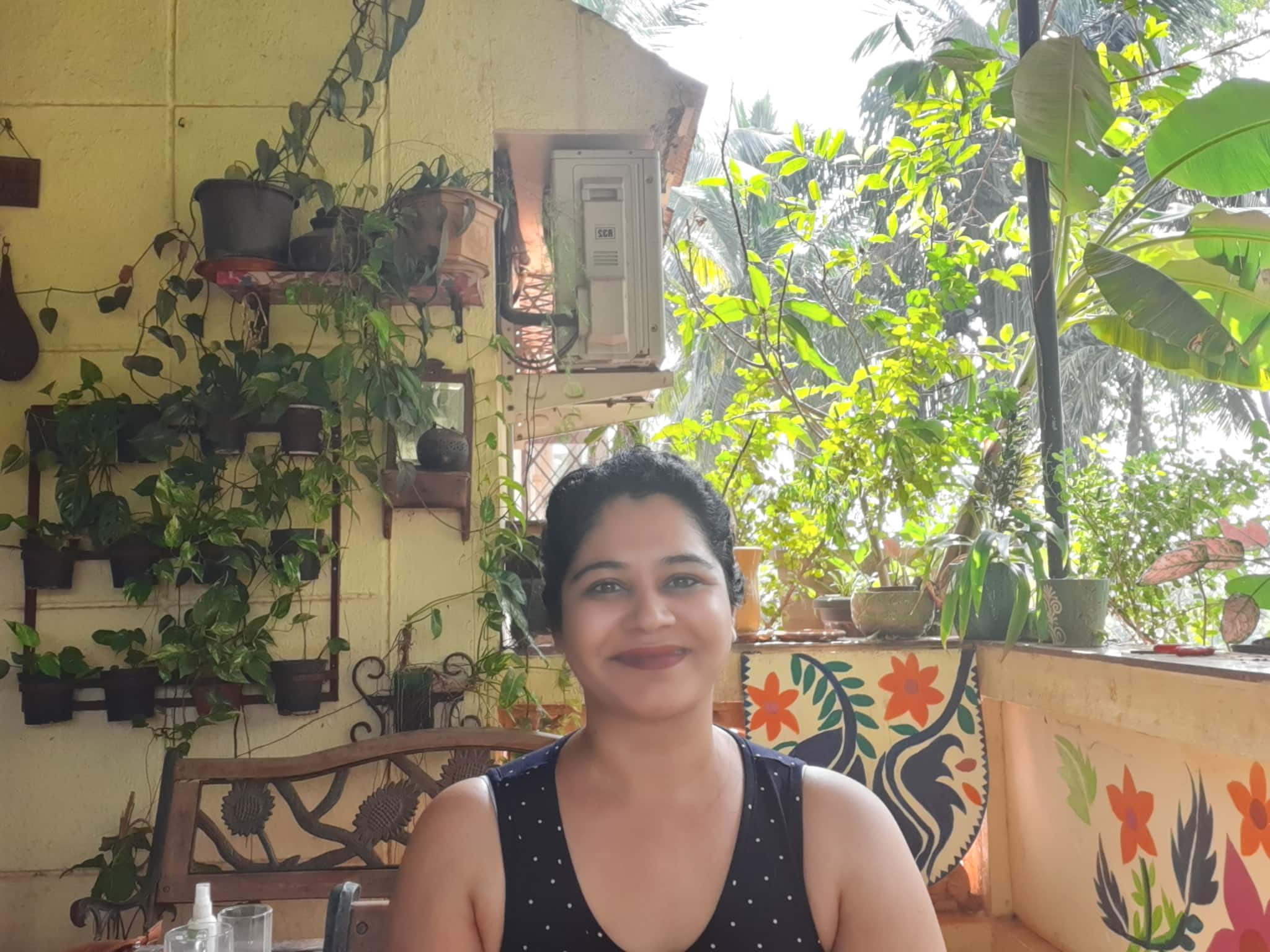 Gauri Gharpure amidst her plants in her apartment in Alto Betim.
