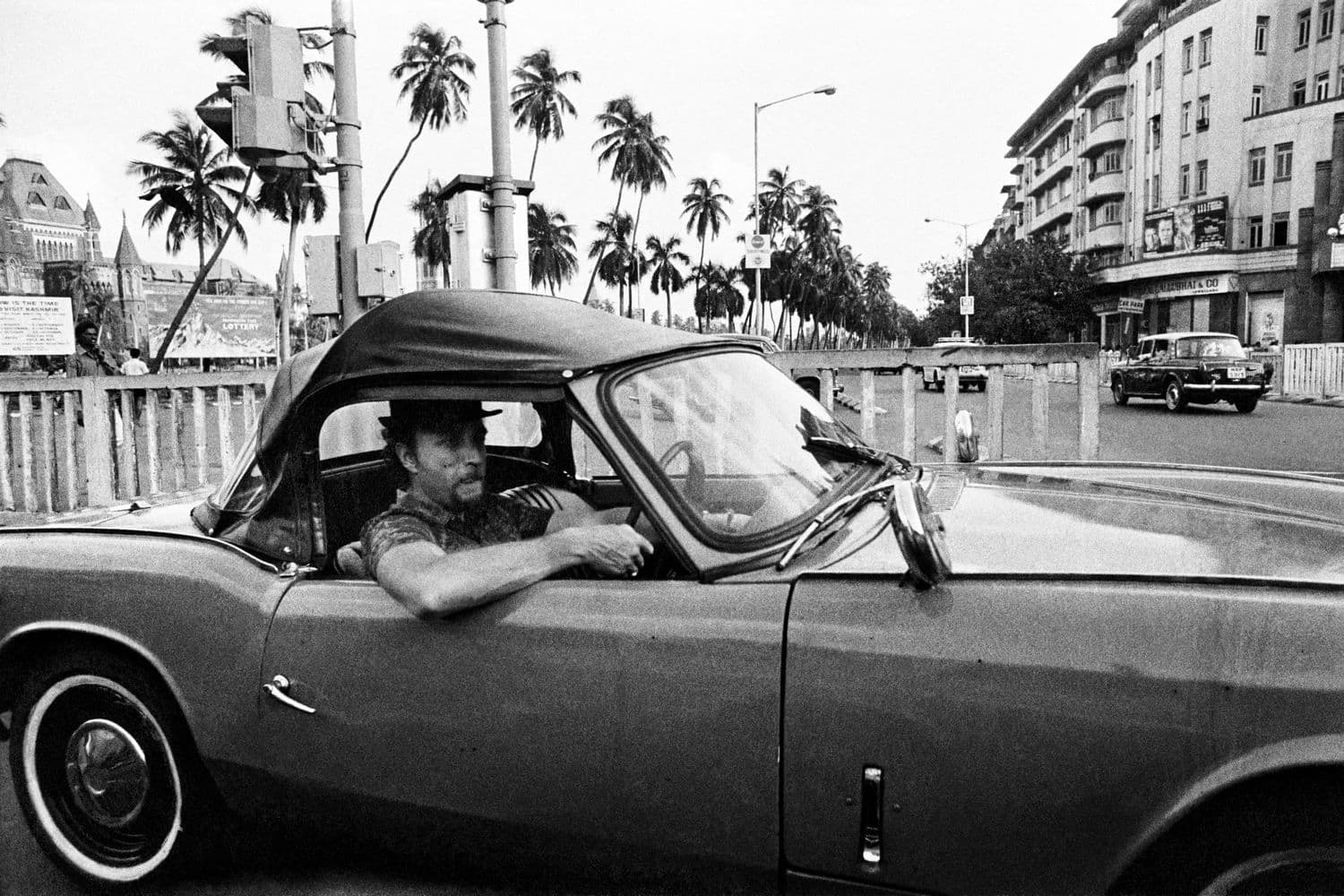 Man in a racing car, Bombay, Photo by Pablo Barthlomew.