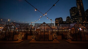 Private cabins are set up on the roof of Pier 17 at South Street Seaport in Manhattan, offering a warm place for groups to rent as temperatures drop, on Dec. 11, 2020. (PC-The New York Times/Benjamin Norman)
