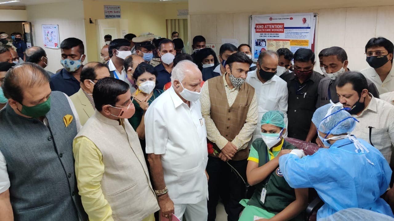 A healthcare worker is given the COVID-19 vaccine shot. Karnataka Chief Minister BS Yediyurappa is also present at the site.