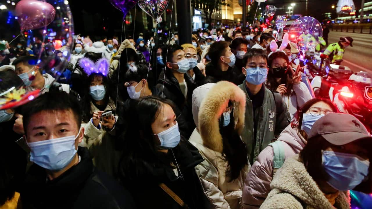 People gather to celebrate the arrival of the New Year in China’s Wuhan, the original epicentre of the novel coronavirus pandemic. (Image: Reuters/Tingshu Wang)