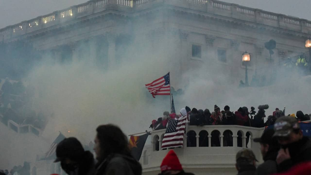 Police clear the US Capitol building with tear gas as supporters of outgoing US President Donald Trump gather outside, in Washington DC, United States on January 6, 2021. (Image: Reuters/Stephanie Keith)