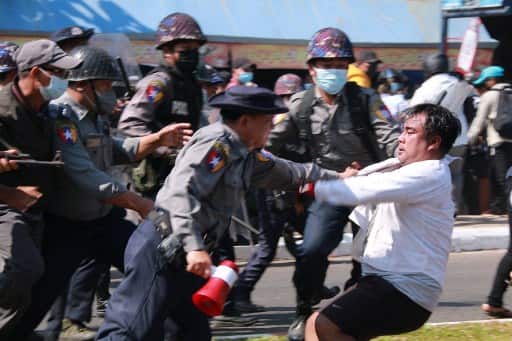 Police arrest a protester during a demonstration against the military coup in Mawlamyine in Mon State on February 12, 2021. (Photo AFP)