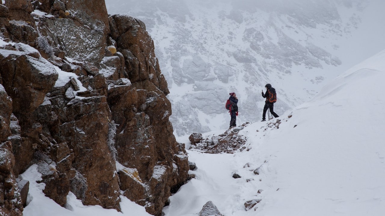 Tourists take pictures during a hike towards the Bogdanovich glacier located in the Tian Shan mountain range near Almaty, Kazakhstan February 20. (Image: Reuters)