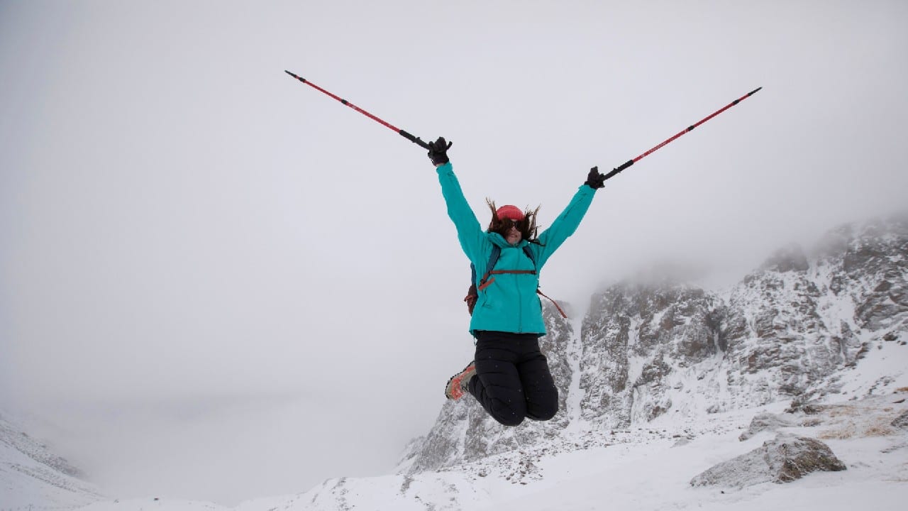 A tourist jumps as she poses for a picture during a hike towards the Bogdanovich glacier located in the Tian Shan mountain range near Almaty, Kazakhstan February 20. (Image: Reuters)