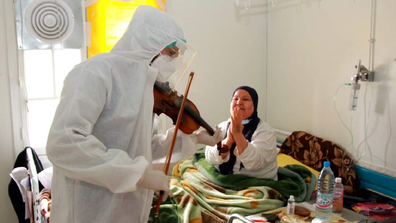When Dr. Mohamed Salah Siala began working on the COVID-19 front line in January in a Tunisian hospital he never imagined harnessing his music skills in the fight against the virus. Yet when the 25-year-old decided to get out his violin one day at Hedi Chaker Hospital in the city of Sfax and play, it won praise for boosting the morale of virus sufferers who remained isolated and needed a smile. (Image: AP)