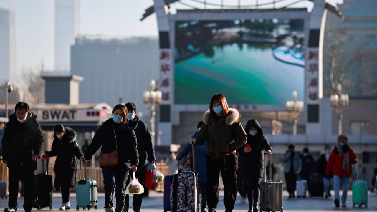 Travellers arrive at Beijing Railway Station ahead of Lunar New Year celebrations as the government urges people to avoid travel because of outbreaks of the coronavirus disease (COVID-19), in Beijing, China, February 8. (Image: Reuters)