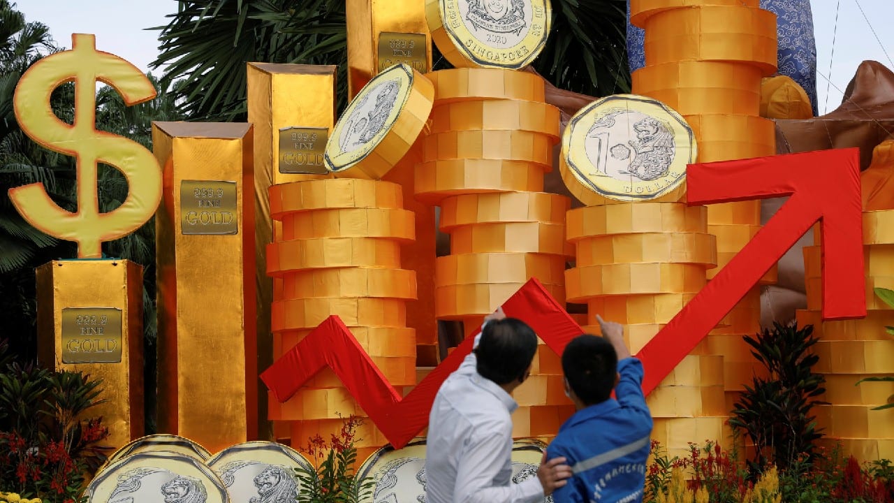 Workers put up final adjustments to Lunar New Year decorations at Gardens by the Bay in Singapore February 8. (Image: Reuters)