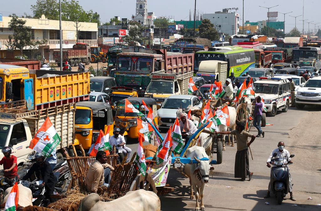 Congress party activists participate in a nationwide shutdown called by thousands of Indian farmers protesting new agriculture laws in Hyderabad, India, Saturday, Feb. 6, 2021. Tens of thousands of protesting Indian farmers plan to blockade highways across the country for three hours Saturday to press their demands for the repeal of new agricultural laws. (AP Photo/Mahesh Kumar A.)
