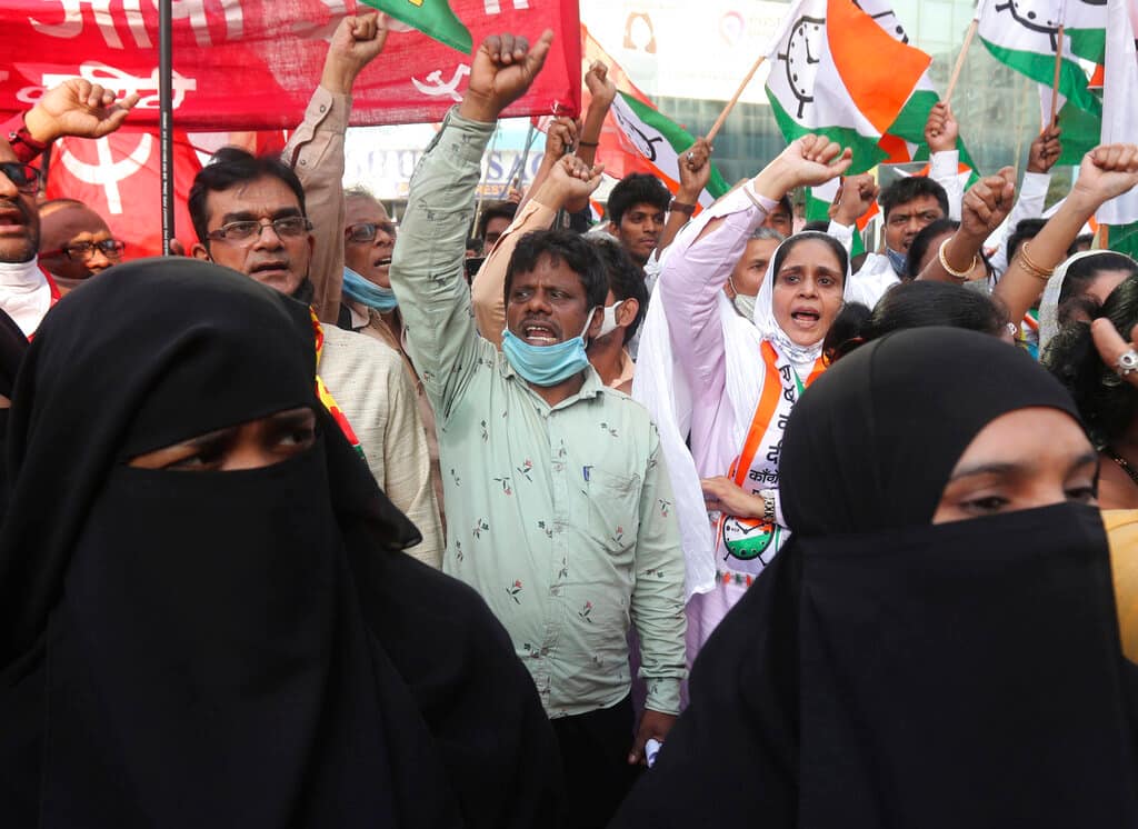 Members of various political parties shout slogans during a protest against new farm laws in Mumbai, India, Saturday, Feb. 6, 2021. Tens of thousands of protesting Indian farmers blocked highways across the country for three hours Saturday to press their demands for the repeal of new agricultural laws. (AP Photo/Rafiq Maqbool)