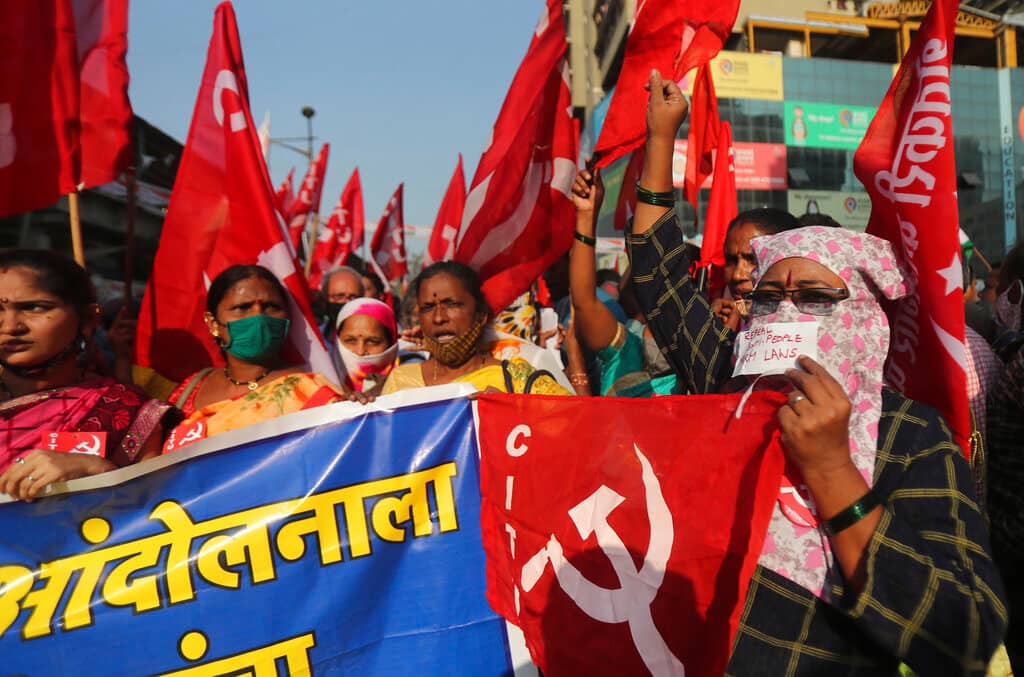 Members of various political parties participate in a protest against new farm laws in Mumbai, India, Saturday, Feb. 6, 2021. Tens of thousands of protesting Indian farmers blocked highways across the country for three hours Saturday to press their demands for the repeal of new agricultural laws. (AP Photo/Rafiq Maqbool)