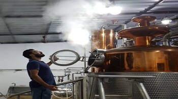 Anand Virmani, CEO and co-founder, NAO Spirits, with copper pot still.