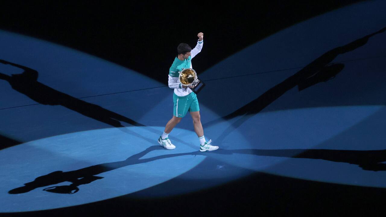Novak Djokovic parades with the Norman Brookes Challenge Cup after defeating Russia's Daniil Medvedev in the men's singles final at the Australian Open tennis championship in Melbourne.(PC-AP Photo/Hamish Blair)