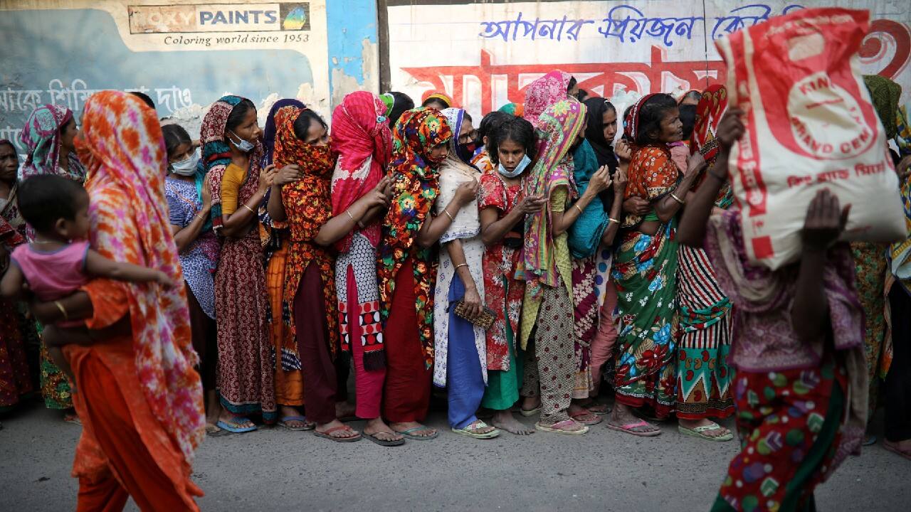Women stand in a queue to receive relief supplies provided by local community amid the coronavirus outbreak in Dhaka, Bangladesh, April 1, 2020. (Image: Reuters)