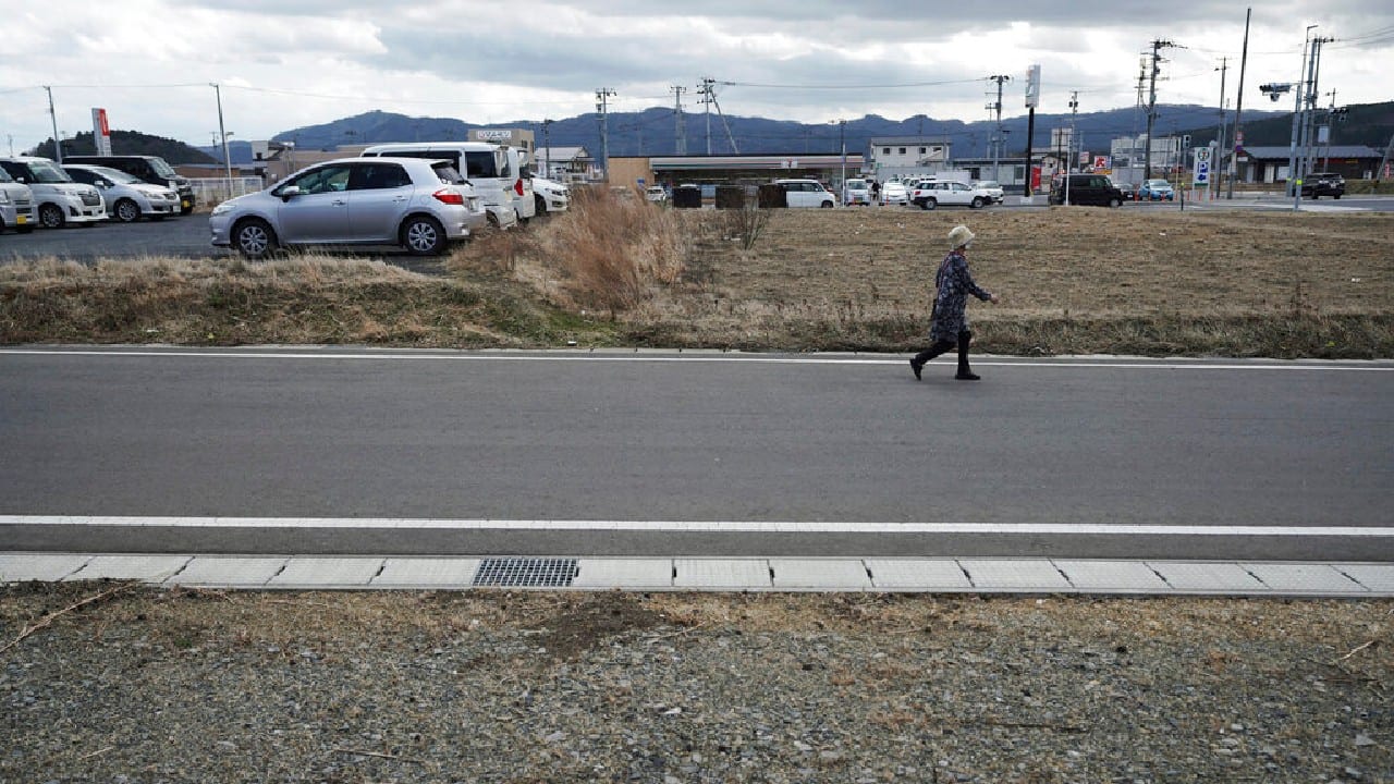 A woman walks through the city of Minamisanriku, Miyagi Prefecture, northern Japan, March 6, 2021, nearly ten years after the Tsunami. (Image: AP)