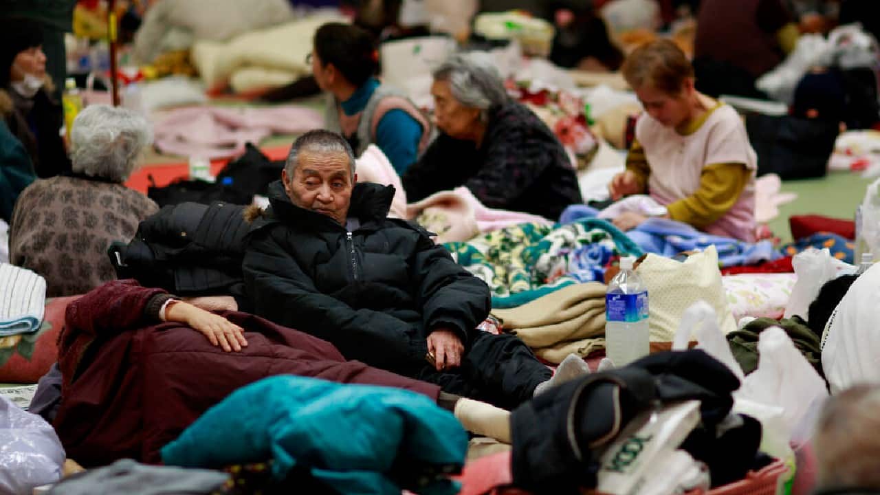 In this March 14, 2011 photo, evacuees rest in a shelter in Soma city, Fukushima prefecture, Japan, three days after a massive earthquake and tsunami struck the country's north east coast. A hydrogen explosion occurs at the Fukushima Daiichi nuclear plant’s No. 1 reactor, sending radiation into the air. Residents within a 20-kilometer (12-mile) radius are ordered to evacuate. Similar explosions occur at two other reactors over the following days. (Image: AP)