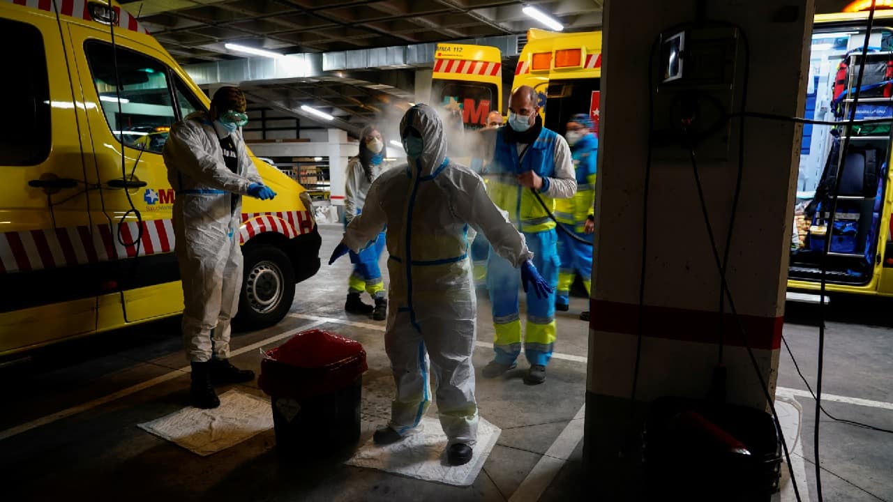 Madrid Emergency Service (SUMMA) UVI-4 unit's technician Maria Angeles Jurado Sanchez is disinfected by a colleague after treating a patient inside his home during the coronavirus disease (COVID-19) outbreak in Madrid, Spain, February 9. (Image: Reuters)