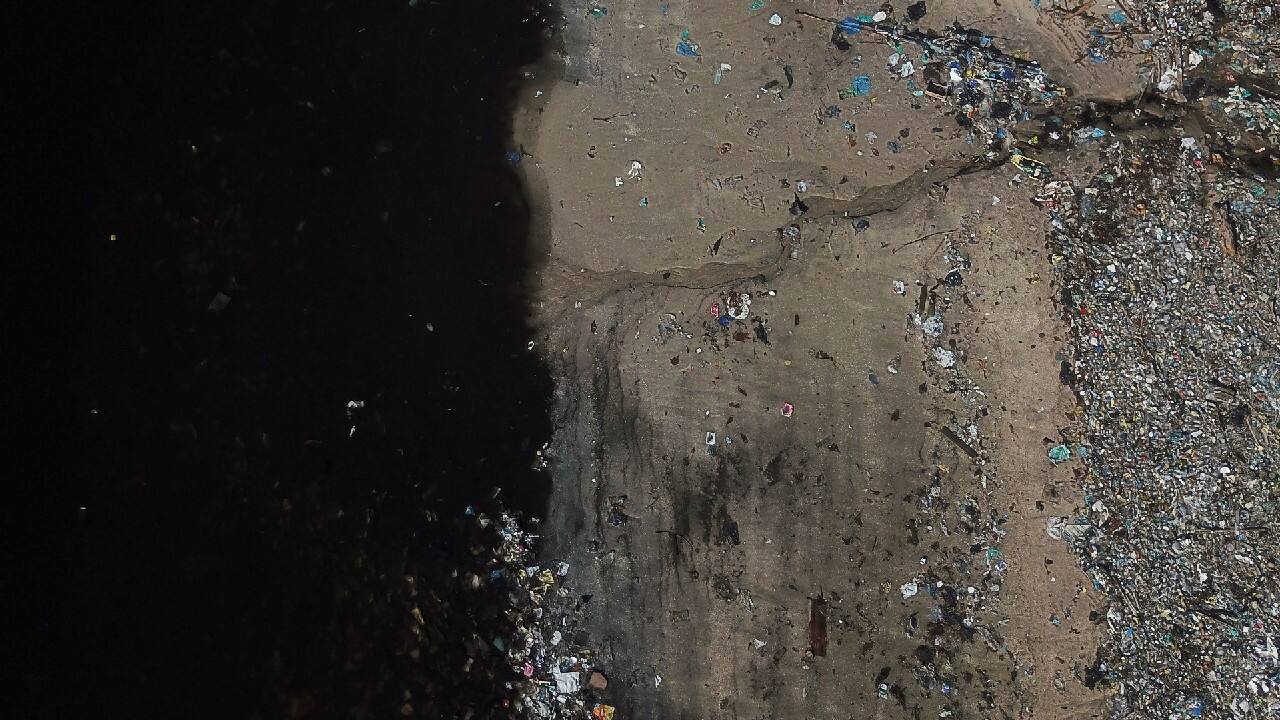 An aerial view shows disposed garbage on the shore of Guanabara bay in Rio de Janeiro, Brazil, March 17, 2021. One of the legacy promises of the 2016 Olympic Games in Rio de Janeiro was the cleanup of Guanabara Bay. After four years, the situation has worsened, according to data from state environmental institute Inea. The environmental degradation of the water bodies in metropolitan Rio is putting at both local ecosystems and public health at risk, says Brazilian biologist Mario Moscatelli. (Image: Reuters)
