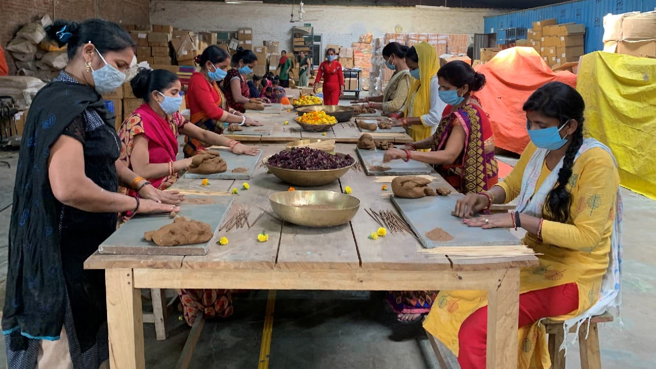 Agarwal’s team, most of whom are women, pluck out the discarded flowers near the river bank and gather them from temples to repurpose them into paper and incense - as well as water colours that can be used for the Hindu festival of Holi. (Image: Reuters)